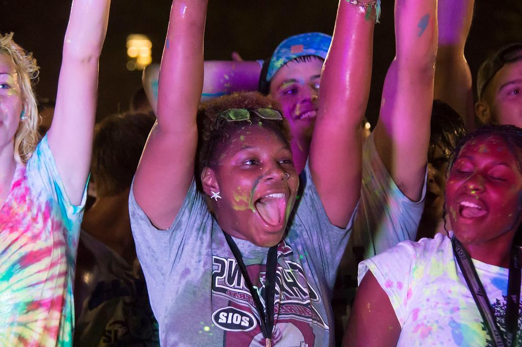 Students covered in paint cheering